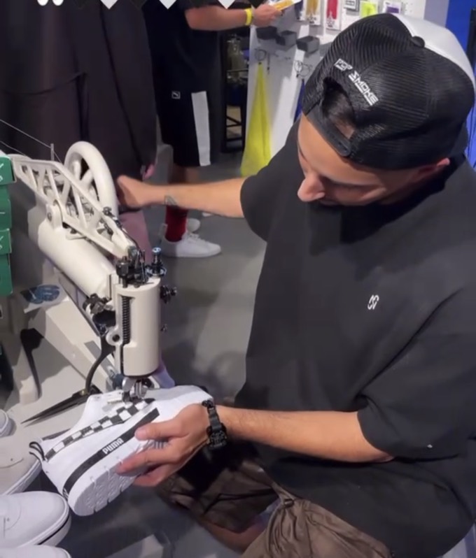 Custom Puma suede sneakers being stitched live at the NYC launch event